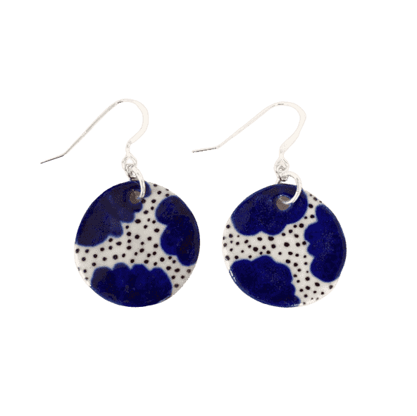 Shuh Lee Ceramic hook Earrings. These have blue, daisy like flowers in the corners and black speckles in the centre.