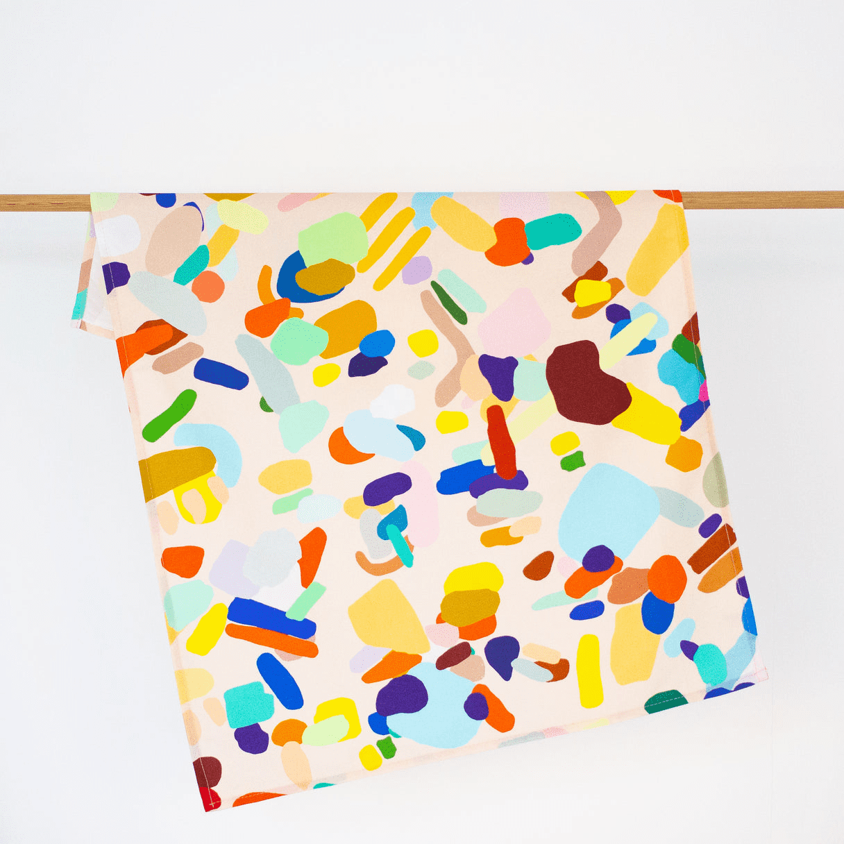A super fun print by Shuh, It has a soft cream background with a mix of colourful abstract shapes.