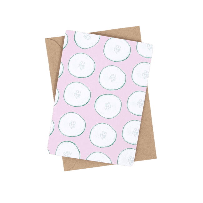 Shuh Lee Cool as a Cucumber Greeting Card. This card has a pastel pink background with green cut outs of cucumbers across the front.