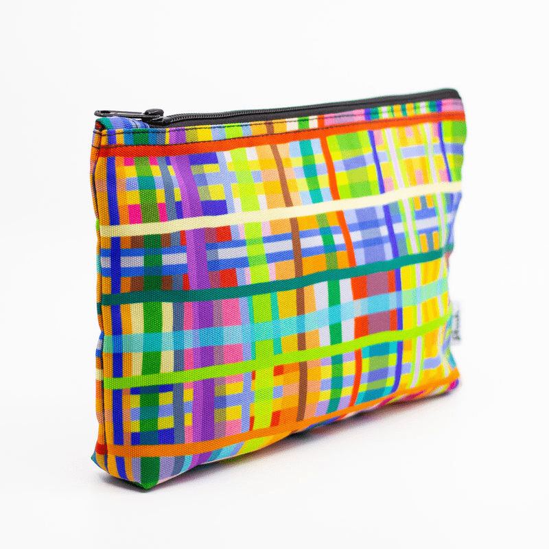 A super bright & colourful useful bag by artist shuh lee. It's a cross hatch design with every colour of the rainbow with neon hues. 