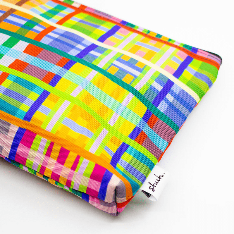 A super bright & colourful useful bag by artist shuh lee. It's a cross hatch design with every colour of the rainbow with neon hues. 