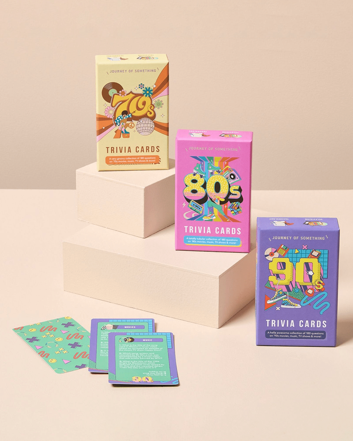 70's trivia cards by Journey of Something: A super cute deck of cards adorned with 70's references like disco balls, gogo boots, daisies and vinyl records around the number 70's. 