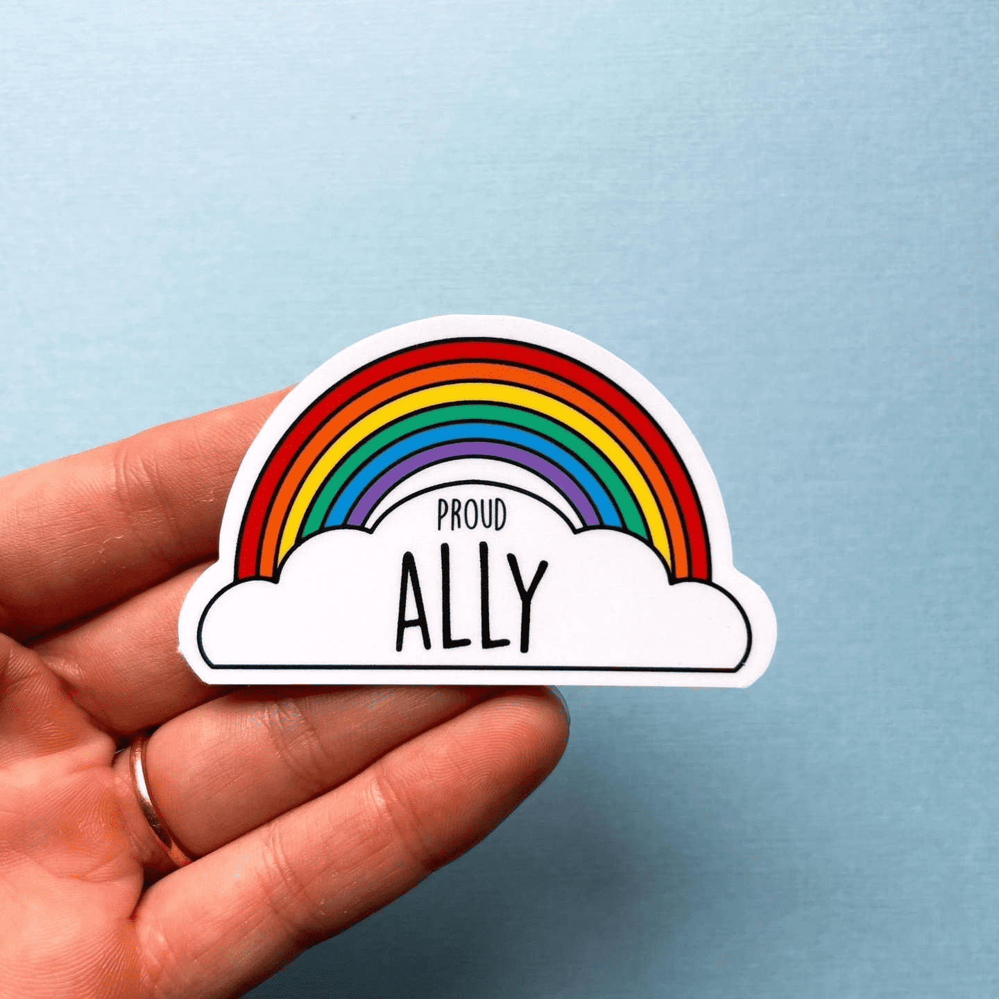 Proud Ally LGBTIQ+ Sticker: Is a little rainbow with a white cloud that reads "Proud Ally" in bold. 