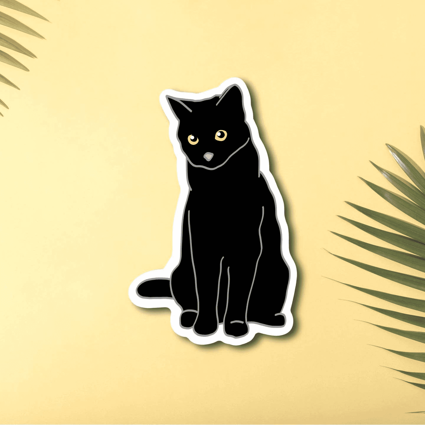 A super cute black cat vinyl sticker, his eyes are gold with a tiny pink nose. 