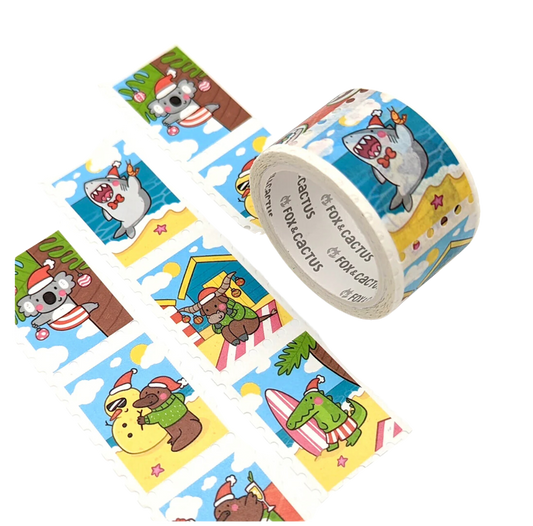 Decorative Christmas washi tape by Fox & Cactus: Cute Aussie animals dressed in xmas attire, on the beach, up trees and in the water in cut out stamp shapes. 
