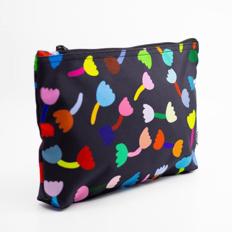 Shuh Lee's Tulip Useful Bag: A colourful print with a black background and multicoloured tulips scattered across the front and back. 