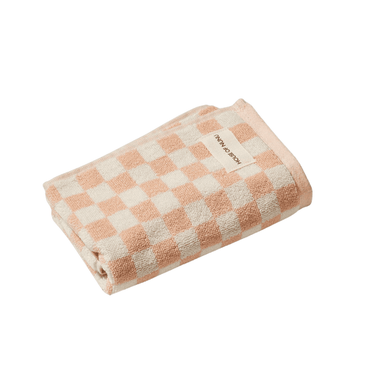A house of Nunu hand towel with pink and white checks. 