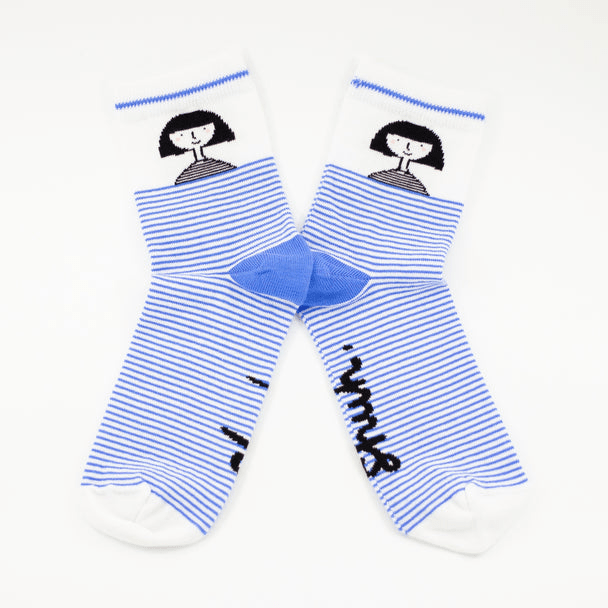 Shuh Lee Girl Striped Socks: Adorable white socks with a bold blue stripe extending from the toe to mid-calf. The heel features the word "shuh," while the ankle showcases a tiny black-and-white portrait of Shuh with her signature bob haircut and a sweet smile.