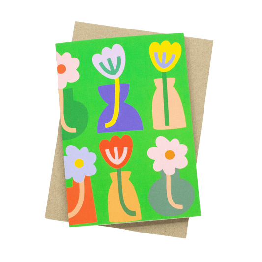 Shuh Lee Vases Greeting card: A bright green background with six colourful vases and flowers across the front and back. 